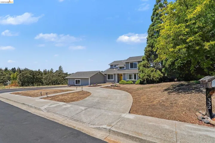 Contemporary two-story residence with a gray exterior and white trim