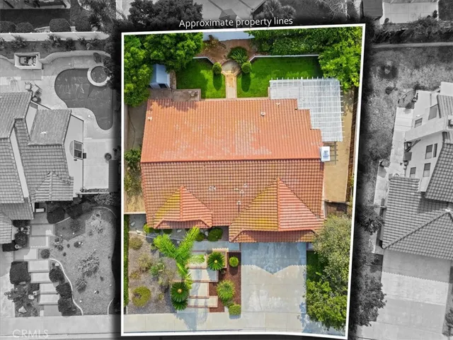 Overhead picture of the house how it sits on the lot, showing fruit trees just behind wall