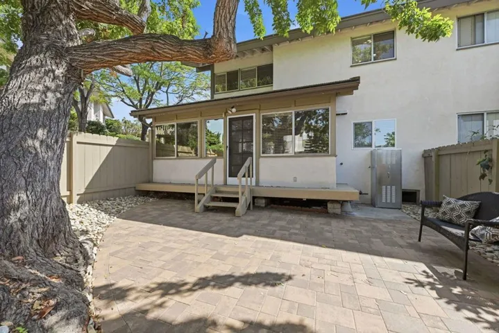 Private space with new pavers, new fence and large shade tree for your relaxation.