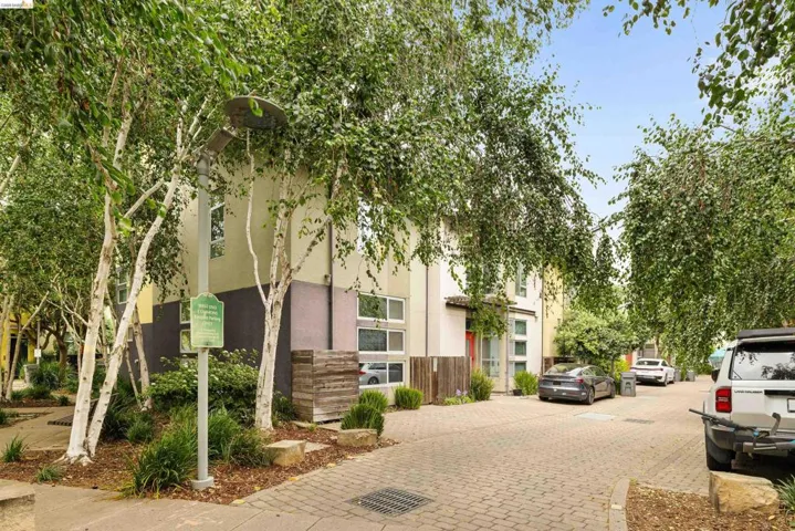 Modern multi-story facade featuring varied siding materials and multi-pane windows