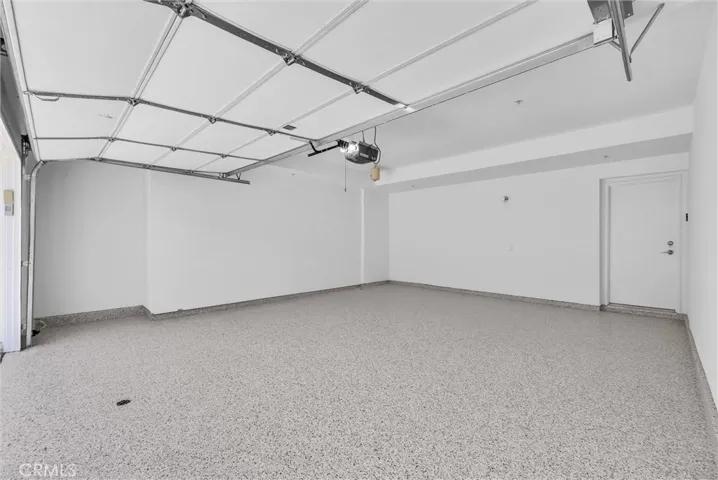 Epoxy garage flooring and new paint makes the garage like another living space