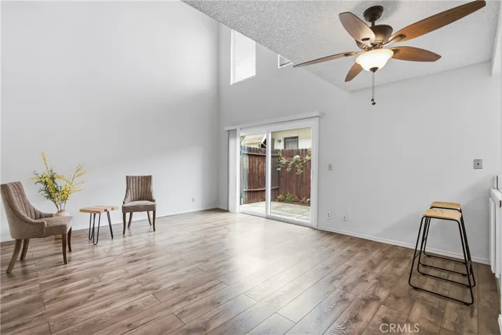 Spacious Open Living Room with Sliding Glass door to Private Patio