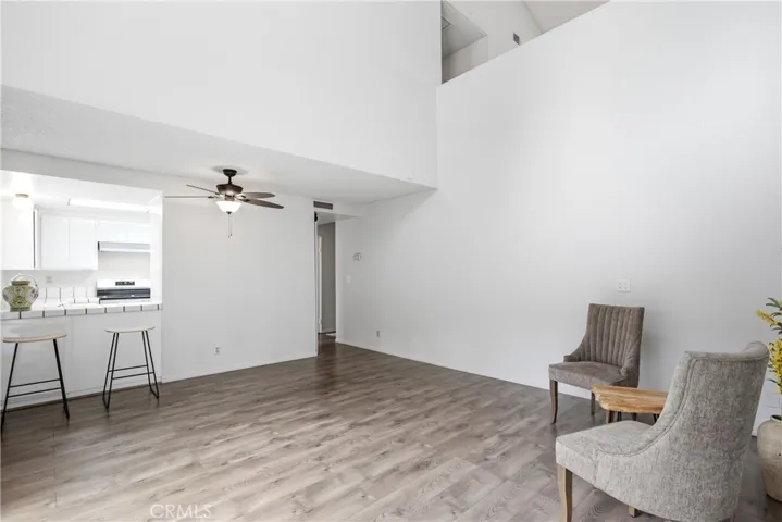 Spacious Open Living Room with Adjacent Dining Area and Breakfast Bar
