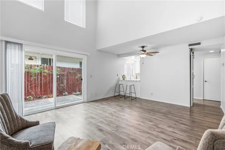 Spacious Open Living Room with Sliding Glass door to Private Patio
