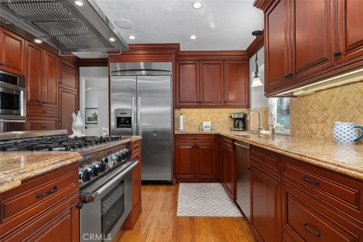 Another look at the kitchen with granite counter tops