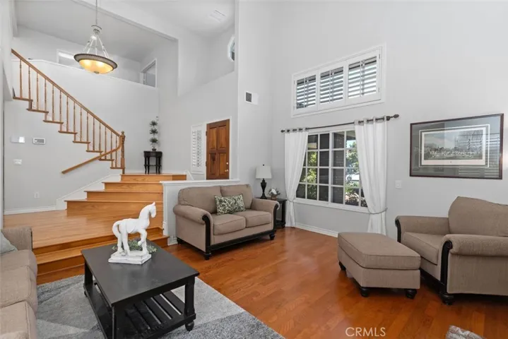 Formal Living Room with dramatic stairscase