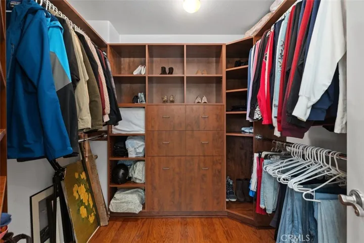 Walk in closet in primary bedroom