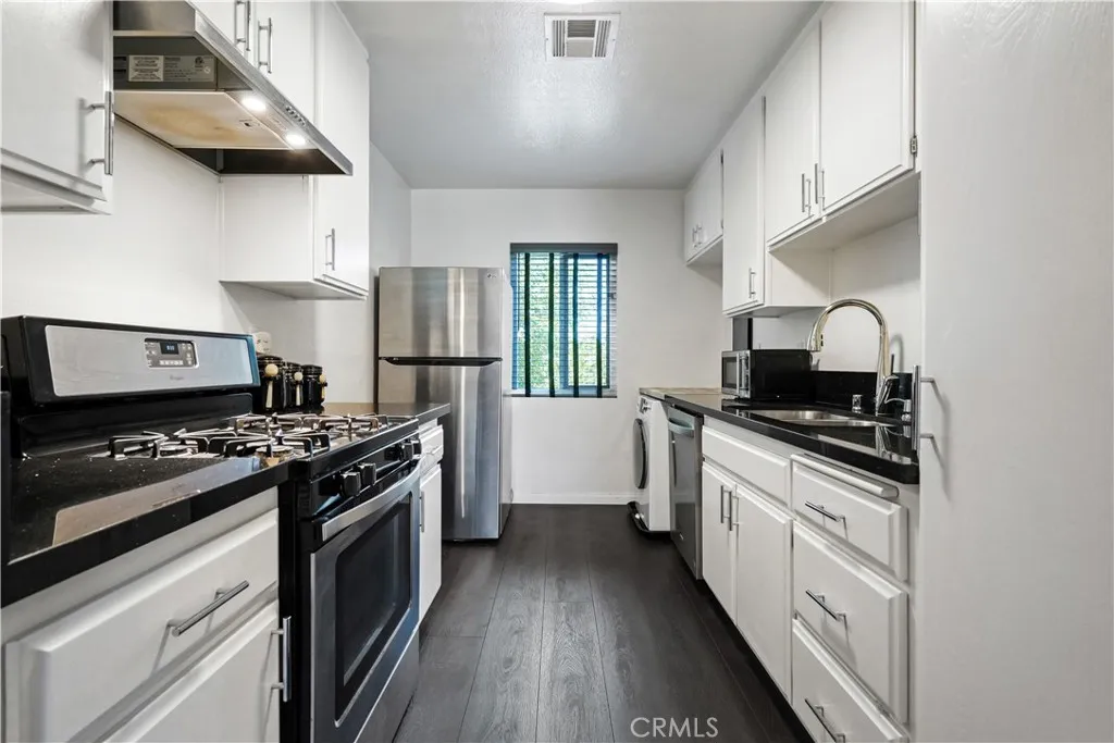 Stone counters and stainless steel appliances.