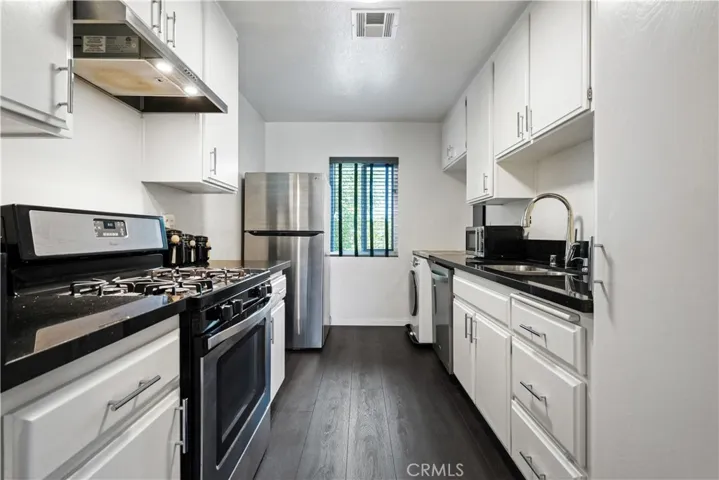 Stone counters and stainless steel appliances.