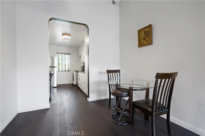 Dining area leading to kitchen.