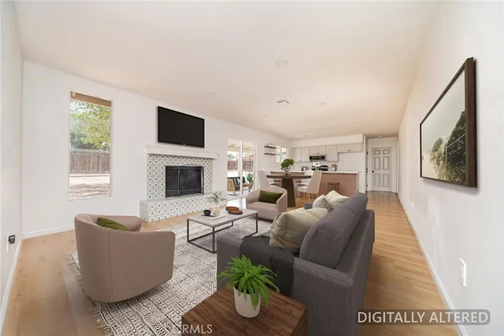 Family Room (Disclaimer: Some images have been digitally enhanced with virtual staging to illustrate potential room layouts and furnishings. Actual property condition and features may vary. Buyer to verify all information independently).