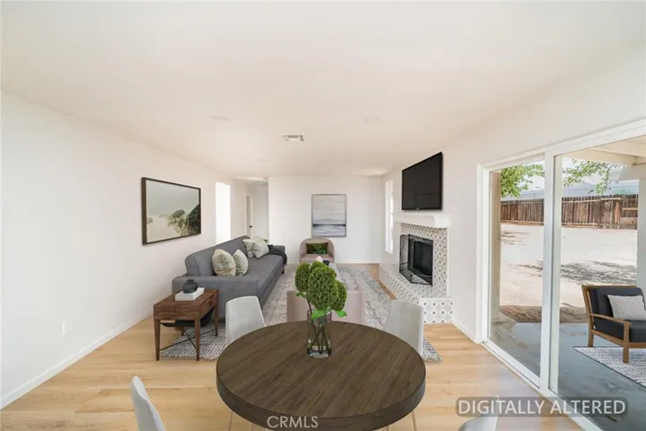 Dining Area/Family Room (Disclaimer: Some images have been digitally enhanced with virtual staging to illustrate potential room layouts and furnishings. Actual property condition and features may vary. Buyer to verify all information independently).