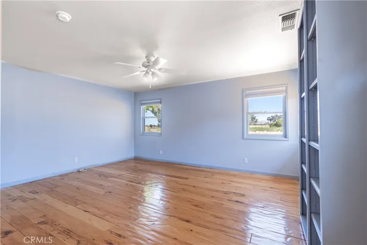 The second bedroom has privacy blinds, a book shelf, walk in closet and private bath