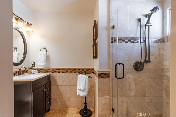 This 3/4 bath for guests is accessed off the utility room and has a Murphy bed nearby