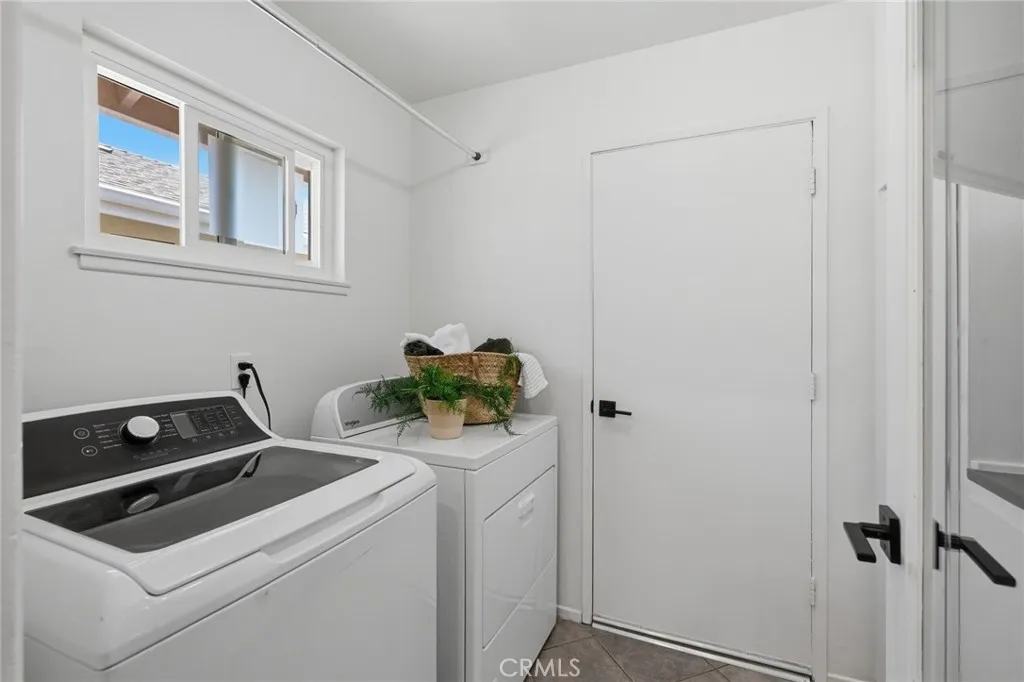 Separate laundry area with window for natural light and ventilation