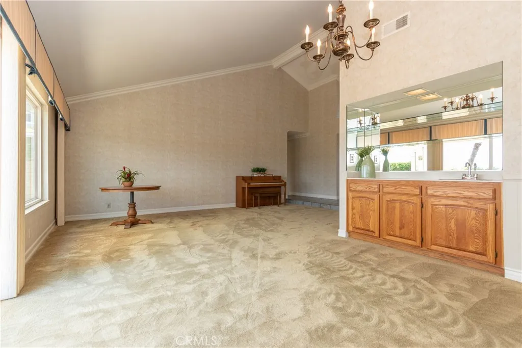 Living room flows into dining room for easy entertaining.