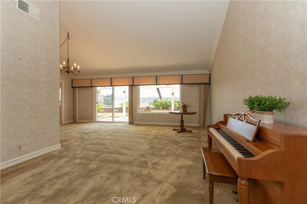 Spacious living room upon entry.