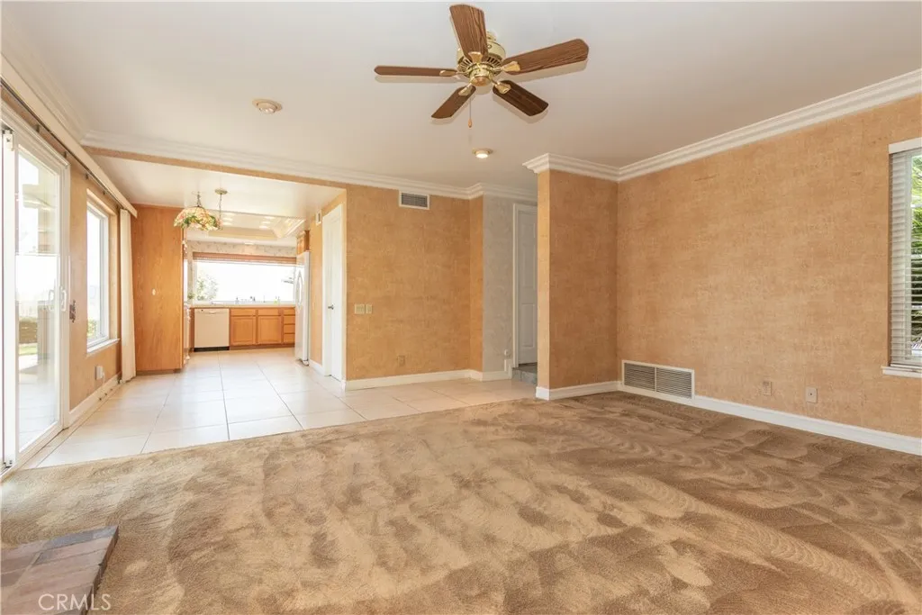 Open floor plan from family room to kitchen.