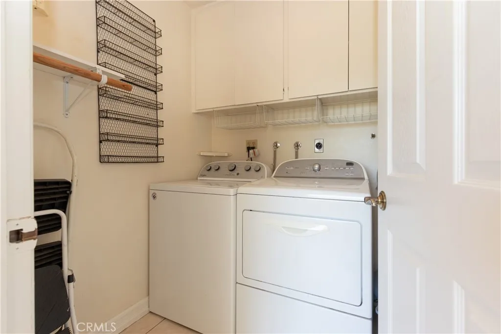 Inside laundry conveniently tucked away off the kitchen and family room.