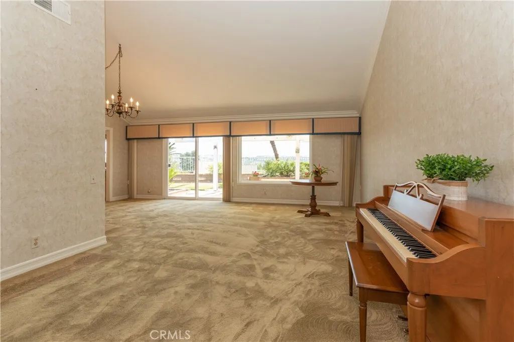 Great floor plan with vaulted ceilings and sliding doors to the patio and view.