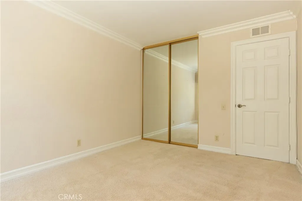Mirrored closet in the third bedroom.