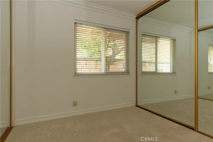 Crown molding and large window in this bedroom.