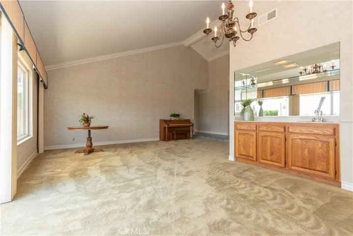 Living room flows into dining room for easy entertaining.