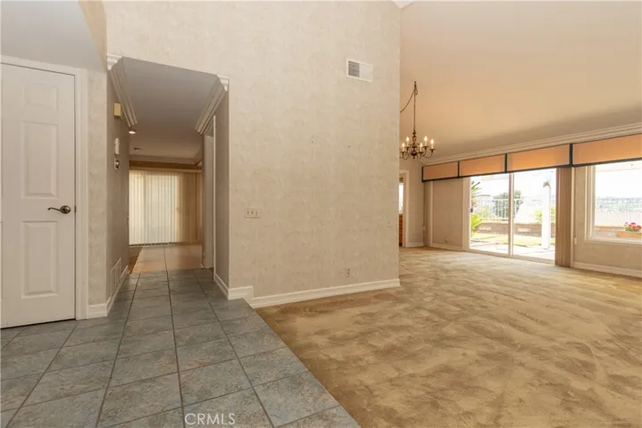 From entry, you can see the hall to the family room as well as the dining area toward the back of the home.