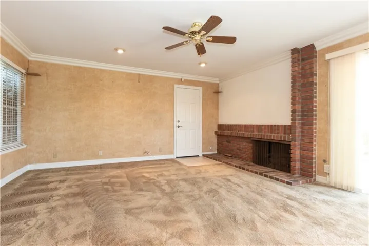 Comfy family room with a handsome fireplace.