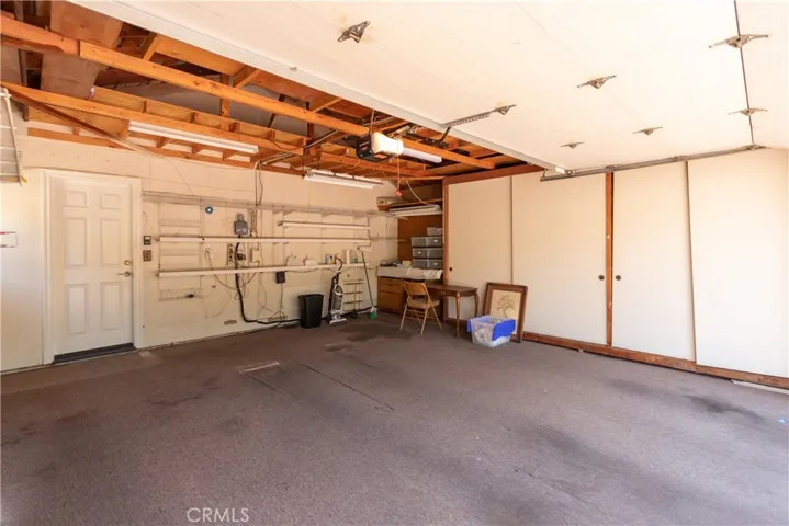 Two car garage with closet storage and lots of overhead space as well.
