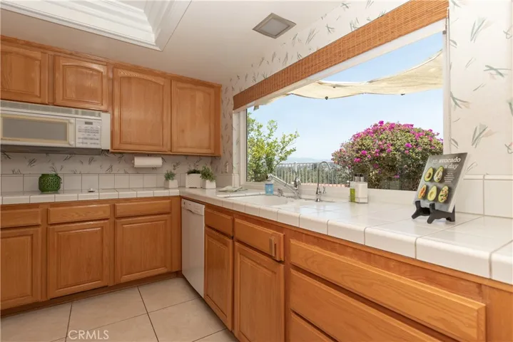 Next is the cheery kitchen with the best view!