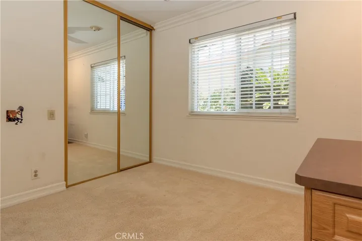 Mirrored closet in the fourth bedroom.