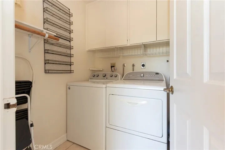 Inside laundry conveniently tucked away off the kitchen and family room.