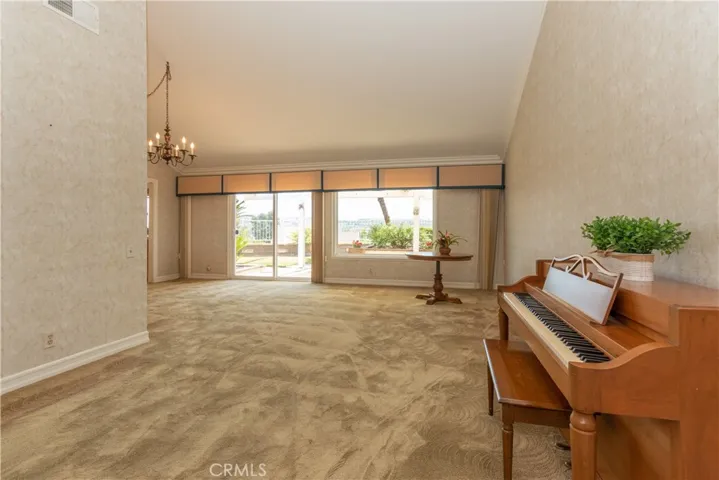 Great floor plan with vaulted ceilings and sliding doors to the patio and view.