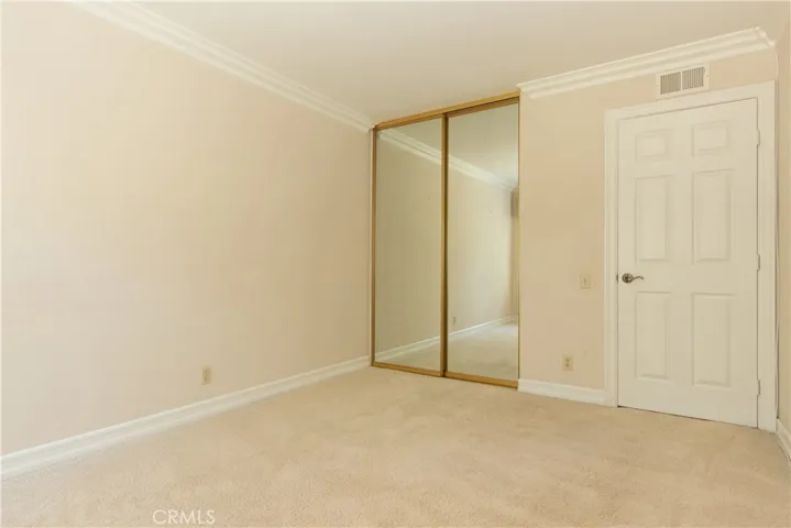 Mirrored closet in the third bedroom.
