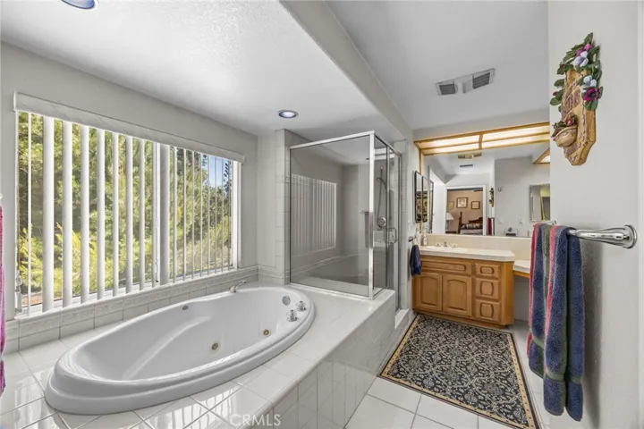 Primary suite with jetted tub & view