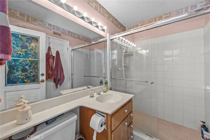 Downstairs primary bath with walk-in shower