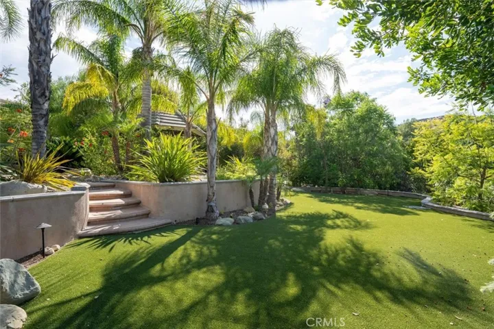 LUSH BACKYARD WITH MATURE LANDSCAPING