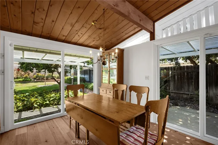 Dining area. Two patios wood beamed ceiling