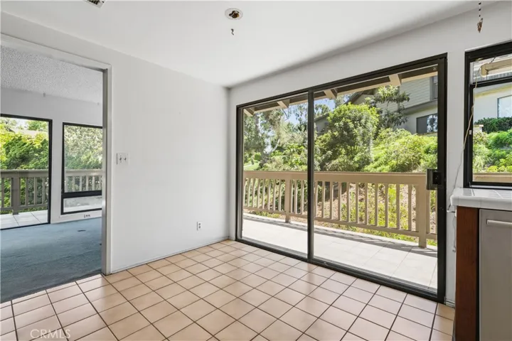Kitchen with outdoor deck and doorway to Dining Room