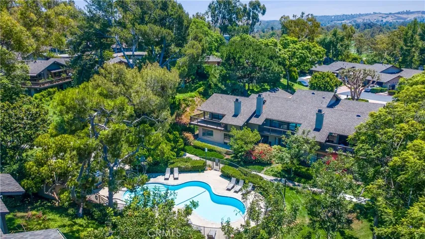 Back of home with pool view