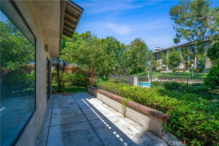 Primary Bedroom patio steps from community pool and spa