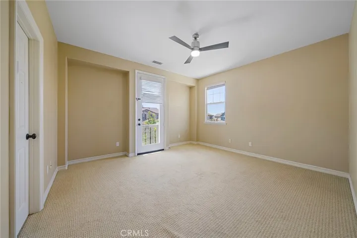 upstairs bedroom with balcony
