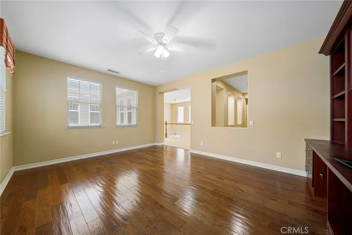 upstairs bonus with ceiling fan and bookcase