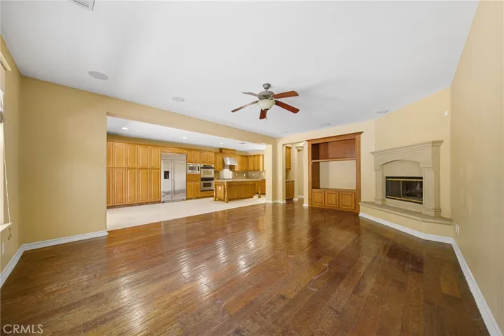 family room with fireplace - kitchen view