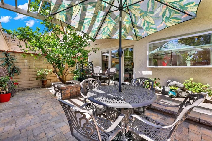 Peaceful yard with lemon tree and pavers.