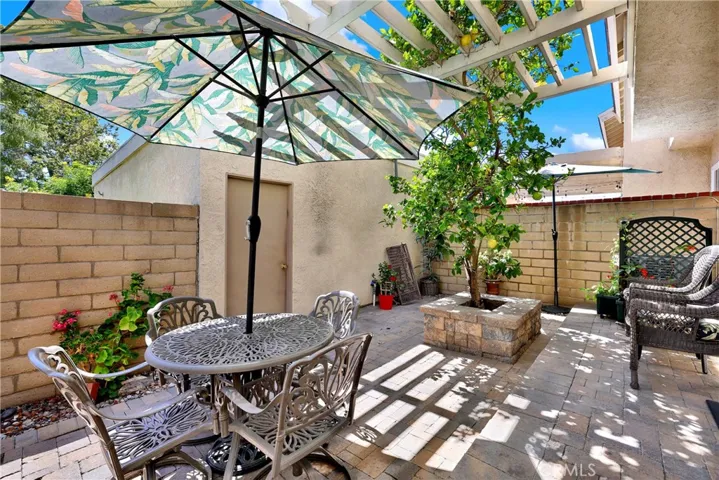 Peaceful yard with lemon tree and pavers.