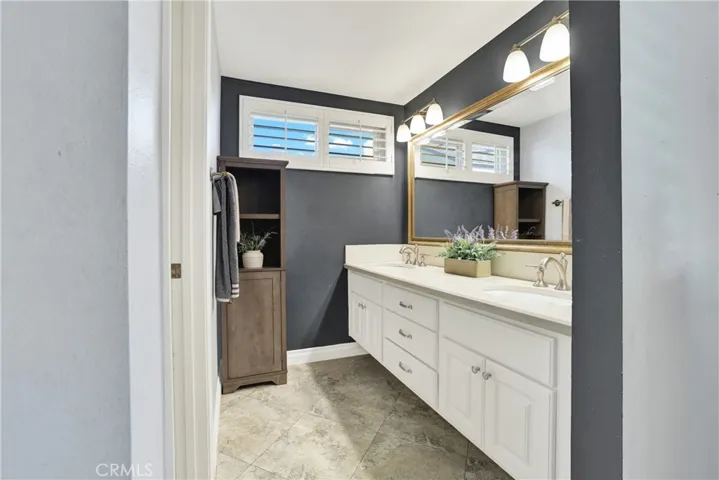 Primary vanity privacy room for toilet and step in shower