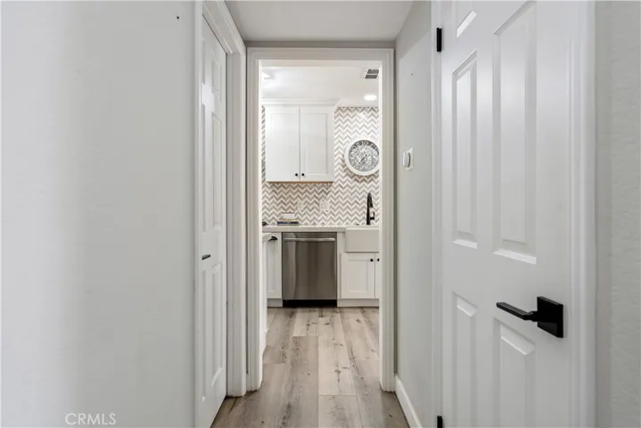 Hallway to kitchen and guest bathroom