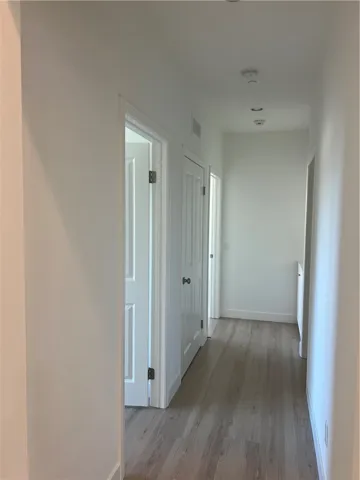 Hall way lead to two bedrooms